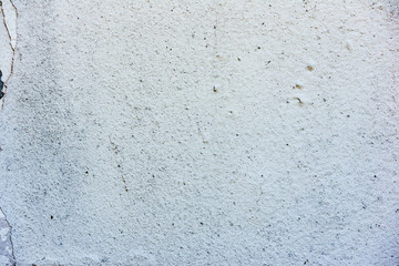 Texture of a concrete wall with cracks and scratches which can be used as a background