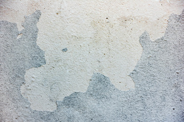 Texture of a concrete wall with cracks and scratches which can be used as a background