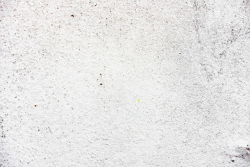 Texture of a concrete wall with cracks and scratches which can be used as a background