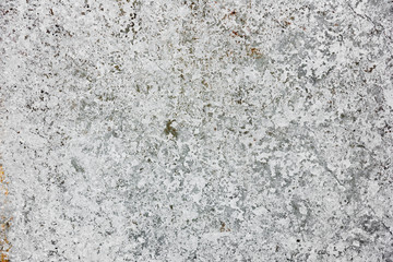 Texture of a concrete wall with cracks and scratches which can be used as a background