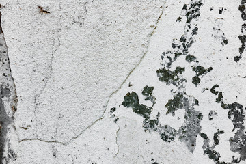 Texture of a concrete wall with cracks and scratches which can be used as a background