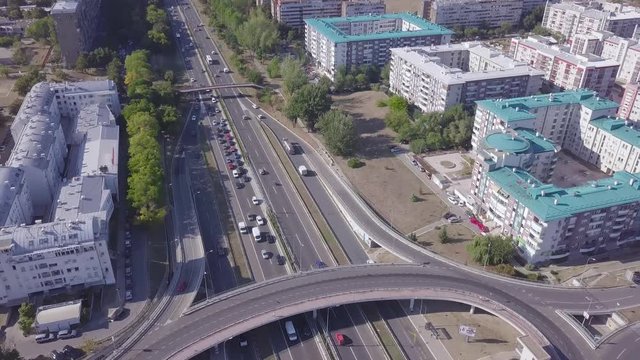 Tilting aerial shot of New Belgrade Roundabout and highway, Genex tower