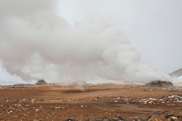 Panorama of geothermal area Hverarönd (Hverir), situated by the orange-red clay coloured tuff mountain Namafjall south of Námaskarð in Iceland, with details and patterns