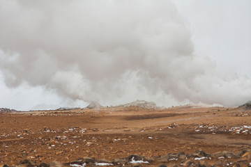 Panorama of geothermal area Hverarönd (Hverir), situated by the orange-red clay coloured tuff mountain Namafjall south of Námaskarð in Iceland, with details and patterns