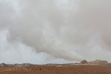 Panorama of geothermal area Hverarönd (Hverir), situated by the orange-red clay coloured tuff mountain Namafjall south of Námaskarð in Iceland, with details and patterns