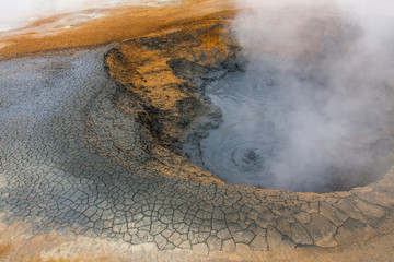 Panorama of geothermal area Hverar&ouml;nd (Hverir), situated by the orange-red clay coloured tuff mountain Namafjall south of N&aacute;maskar&eth; in Iceland, with details and patterns