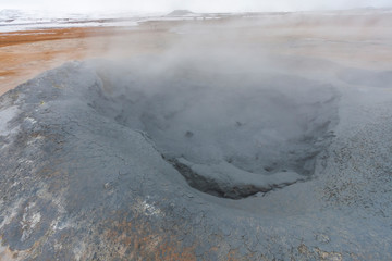 Panorama of geothermal area Hverar&ouml;nd (Hverir), situated by the orange-red clay coloured tuff mountain Namafjall south of N&aacute;maskar&eth; in Iceland, with details and patterns