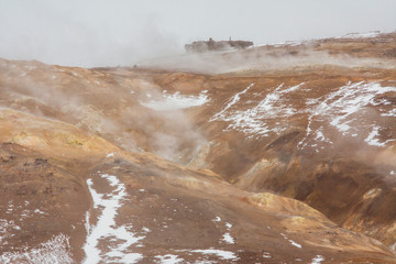 Panorama of geothermal area Hverarönd (Hverir), situated by the orange-red clay coloured tuff mountain Namafjall south of Námaskarð in Iceland, with details and patterns