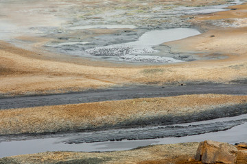 Panorama of geothermal area Hverar&ouml;nd (Hverir), situated by the orange-red clay coloured tuff mountain Namafjall south of N&aacute;maskar&eth; in Iceland, with details and patterns