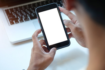 Cropped shot view of man hands holding smart phone with blank copy space screen for your text message or information content, female reading text message on cell telephone during in urban setting. 