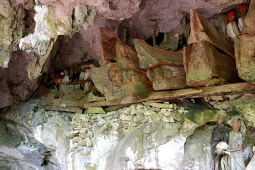 Rotten Coffins, Guardians of the Dead (Tau-Tau’s) and Human Skulls in the Tampang Allo Burial Cave, Sulawesi, Indonesia