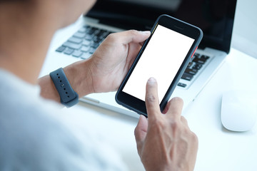 Cropped shot view of man hands holding smart phone with blank copy space screen for your text message or information content, female reading text message on cell telephone during in urban setting. 