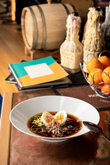 Traditional russian summer soup okroshka with kvass, eggs and fresh vegetables