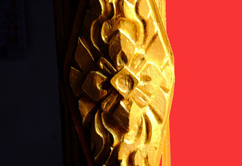 Vintae carving art work flower pattern on the old chapel door in Korat province Thailand. 