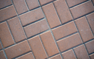 Texture of paving slabs overgrown with grass. Background image of a stratum stone