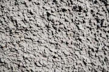 Texture photo of white rough concrete plaster