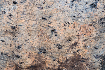 The texture of the stone overgrown with moss. Background image of a boulder