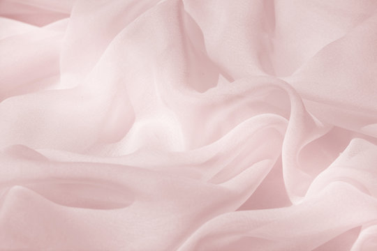 Light draped chiffon fabric in pink for festive backgrounds