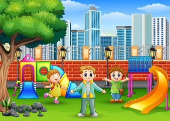 Obraz na płótnie Canvas Happy children playing on a public park