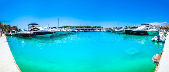 Majorca, Spain - June 2018: Luxury yachts at marina of Port Adriano on Mallorca, Mediterranean Sea, Balearic Islands