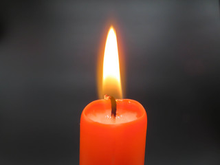 orange candle in the dark