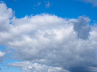 Gray clouds on a blue sky background