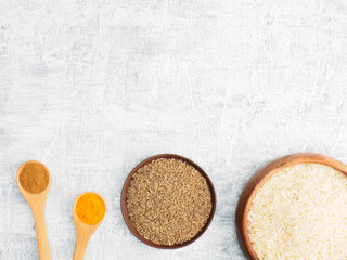 Spices set and rice on white concrete background. Modern apothecary, naturopathy and ayurveda concept.
