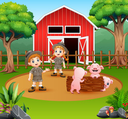 A zookeepers boy and girl on the farm yard