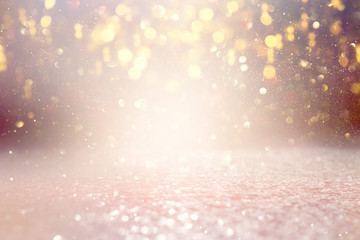 background of abstract glitter lights. gold and silver. de focused
