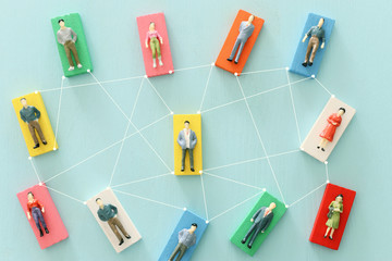 business concept image of people figures over wooden table, human resources and management concept