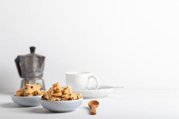 a serving of homemade cookie dough on a white background.