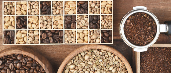 Close up of coffee beans and ground coffee in wooden bowl