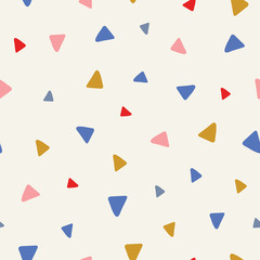 Sweet vector seamless repeat pattern of tossed hand drawn triangles in pink, red, blue and yellow. A fun random repeat design background.