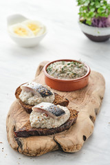 Forshmak - traditional Jewish cuisine. Sandwich with minced herring fillets with apple, onion and egg.