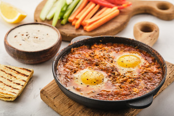 Shakshuka, Fried Eggs in Tomato Sauce. Traditional Mediterranean Fried Eggs. Israeli cuisine.