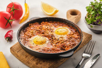 Shakshuka, Fried Eggs in Tomato Sauce. Traditional Mediterranean Fried Eggs. Israeli cuisine.