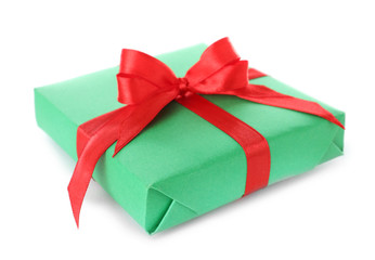 Christmas gift box decorated with ribbon bow on white background