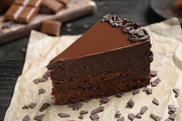 Delicious fresh chocolate cake on table, closeup