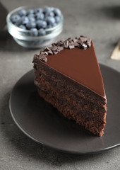 Delicious fresh chocolate cake served on grey table