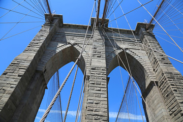 Brooklyn Bridge pylon on blue sky, NY