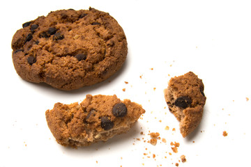 Sweet cookies with raisins isolated on a white background. Whole cookies and pieces and crumbs of cookies.