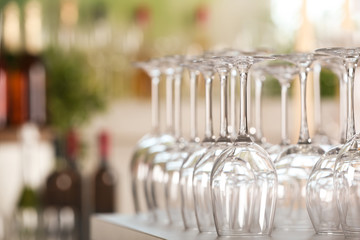 Empty glasses on table against blurred background