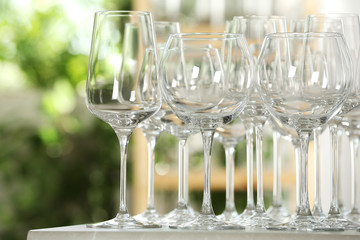 Empty glasses on table against blurred background