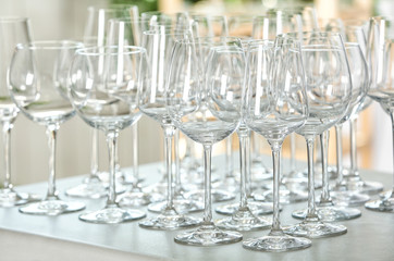 Set of empty glasses on grey table