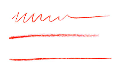 Red pencil scribbles on white background, top view