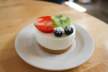 cheesecake or cheese cake with strawberry and kiwi fruit topping