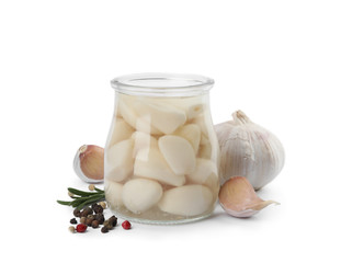 Composition with jar of pickled garlic on white background