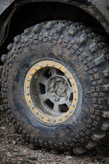 Fototapeta na wymiar Muddy off road tire on a 4x4 car