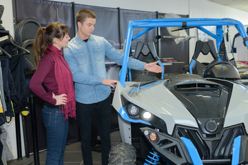 beautiful young couple in the showroom