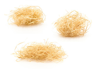 Set of yellow slender hay balls close-up on a white background © bqmeng